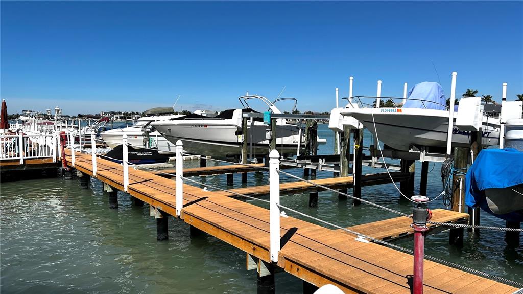 8901 Blind Pass Road, Unit 224 St. Pete Beach, FL 33706 - Photo 45 of 46 a view of a swimming pool with outdoor seating