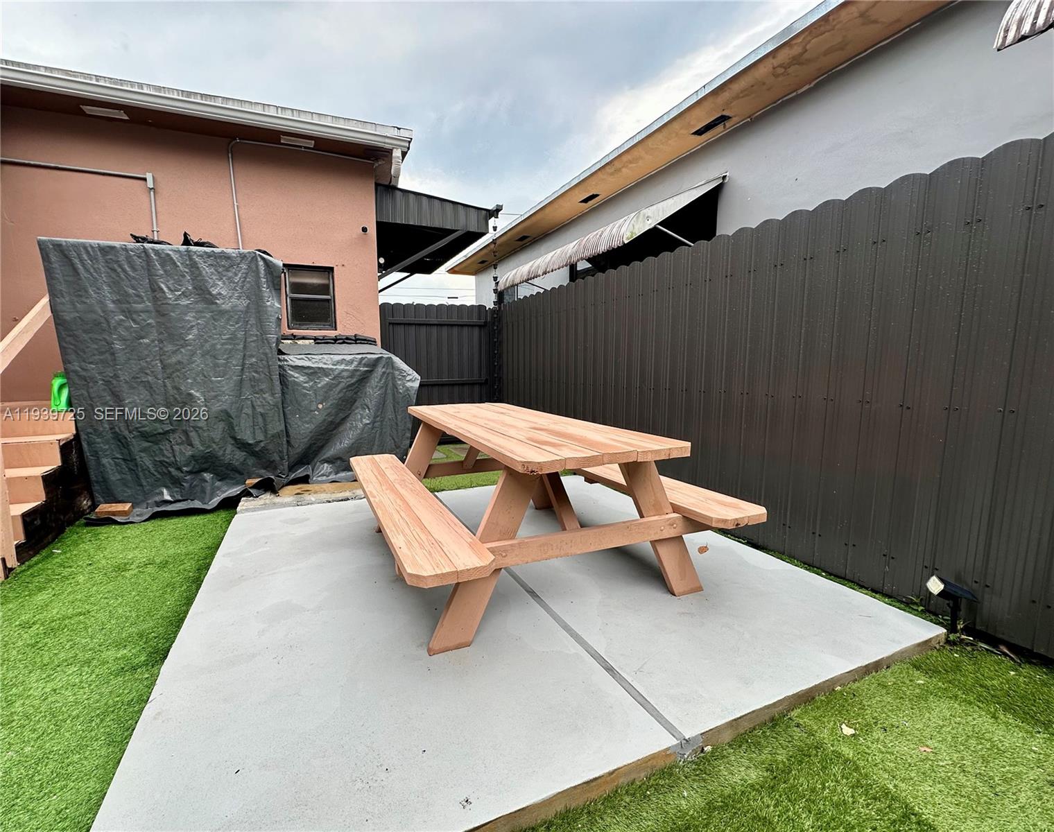 1309 Northwest 55th Terrace, Unit STUDIO Miami, FL 33142 - Photo 14 of 18 a view of backyard with outdoor seating