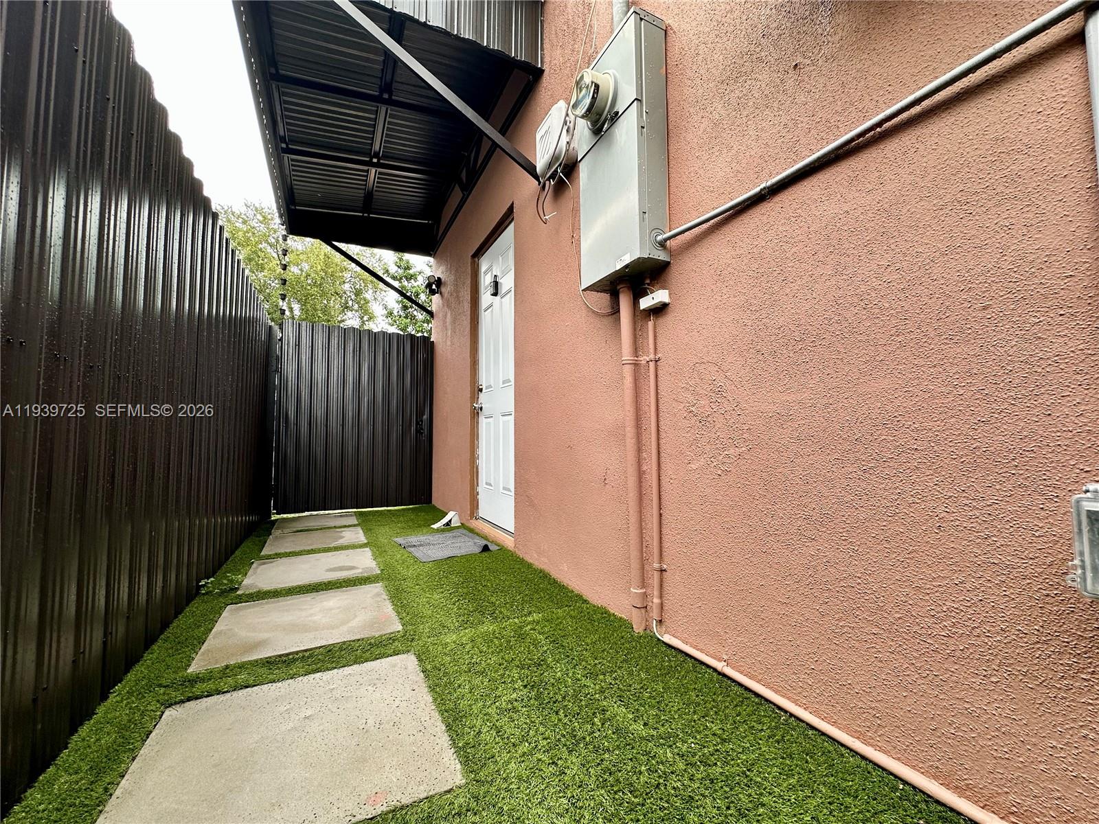 1309 Northwest 55th Terrace, Unit STUDIO Miami, FL 33142 - Photo 17 of 18 a view of small yard