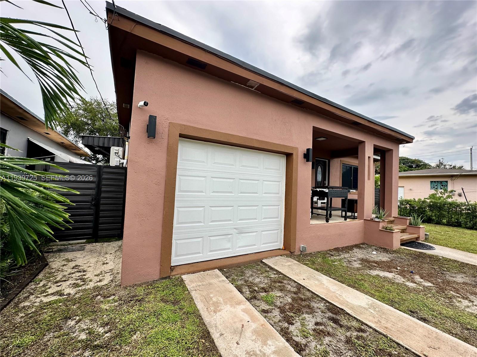 1309 Northwest 55th Terrace, Unit STUDIO Miami, FL 33142 - Photo 18 of 18 a front view of a house