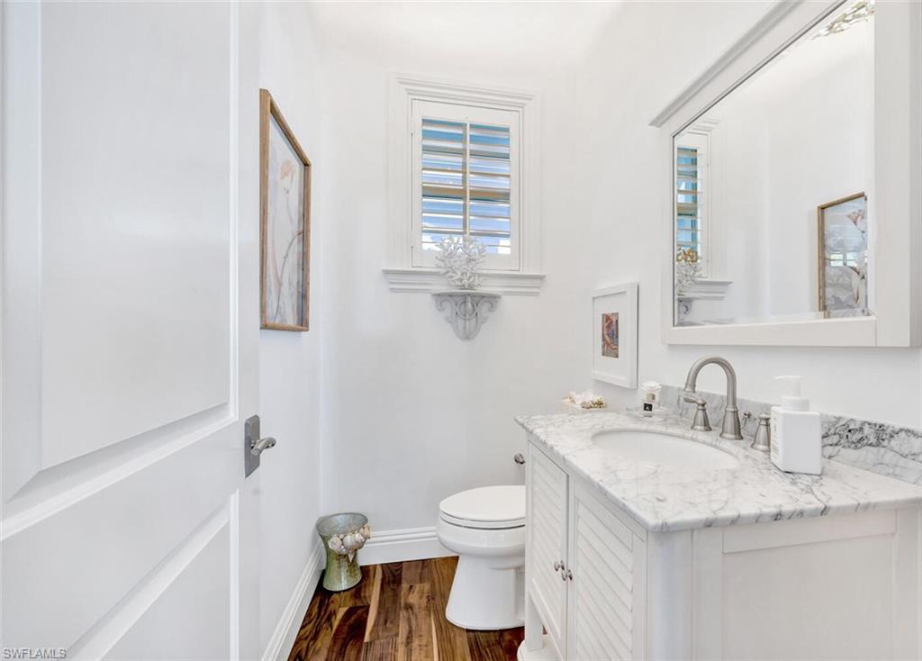Undisclosed Address Naples, FL 34102 - Photo 20 of 44 a bathroom with a granite countertop sink toilet and shower
