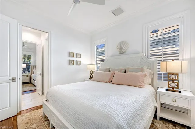 a bedroom with a large bed and a window