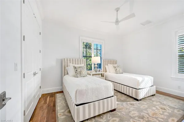 a bedroom with a bed and a night stand