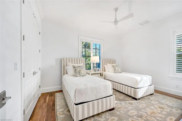 a bedroom with a bed and a night stand