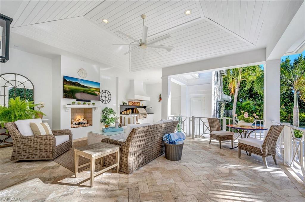 Undisclosed Address Naples, FL 34102 - Photo 32 of 44 a living room with furniture and a large window