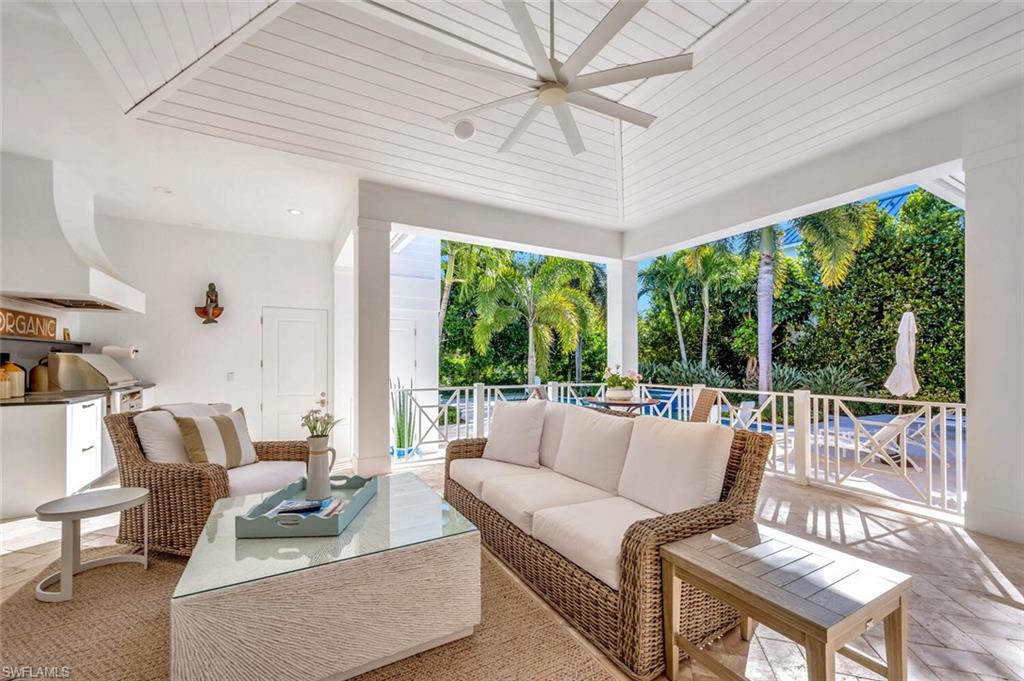 Undisclosed Address Naples, FL 34102 - Photo 34 of 44 a living room with furniture and a large window
