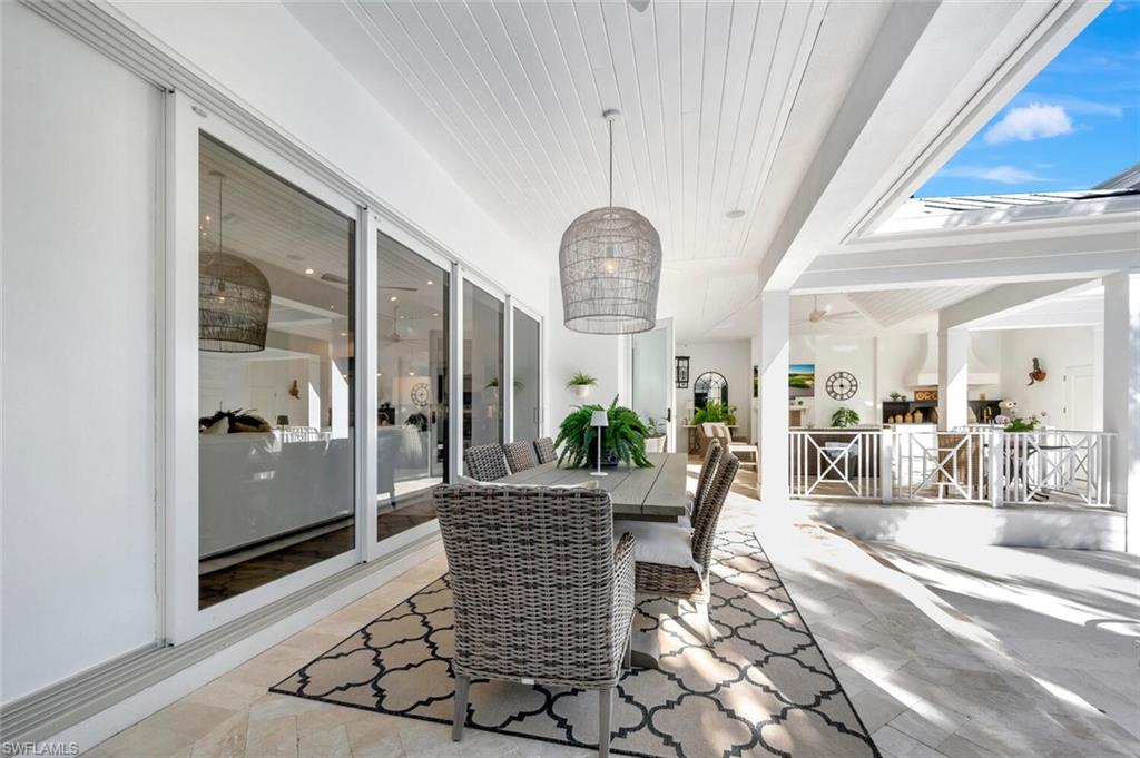 Undisclosed Address Naples, FL 34102 - Photo 43 of 44 a view of a livingroom with furniture and window
