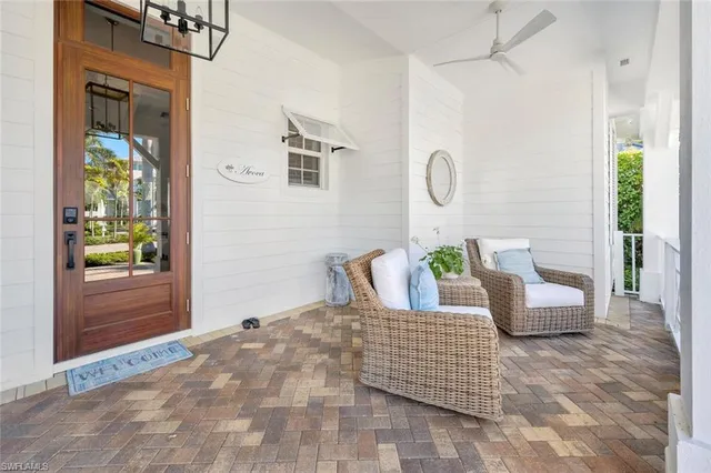 a bedroom with a bed a couch and a window