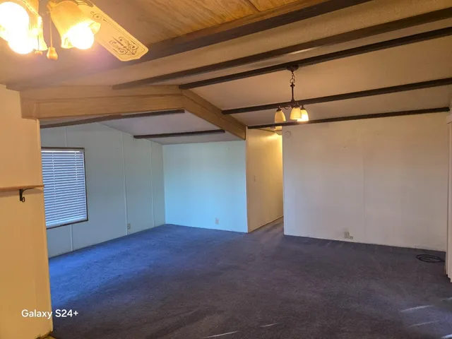 a kitchen with a sink cabinets and a window