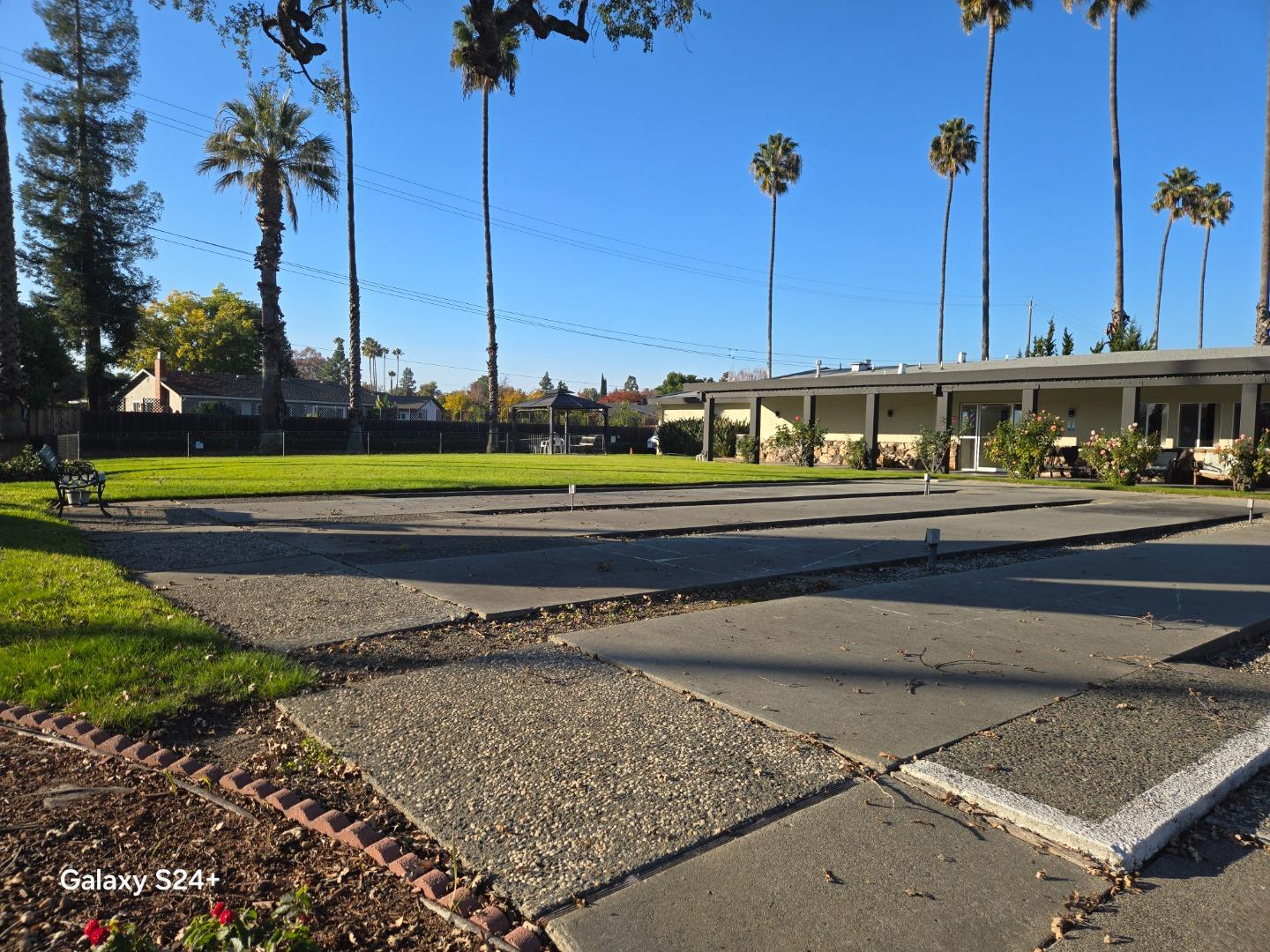 195 Blossom Hill Road, Unit 290 San Jose, CA 95123 - Photo 21 of 28 a view of a tall building next to a yard