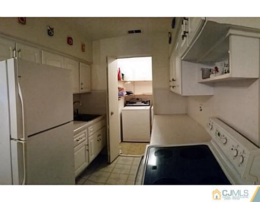 21 Haven Road Old Bridge, NJ 08857 - Photo 4 of 8 a kitchen with a refrigerator and a sink