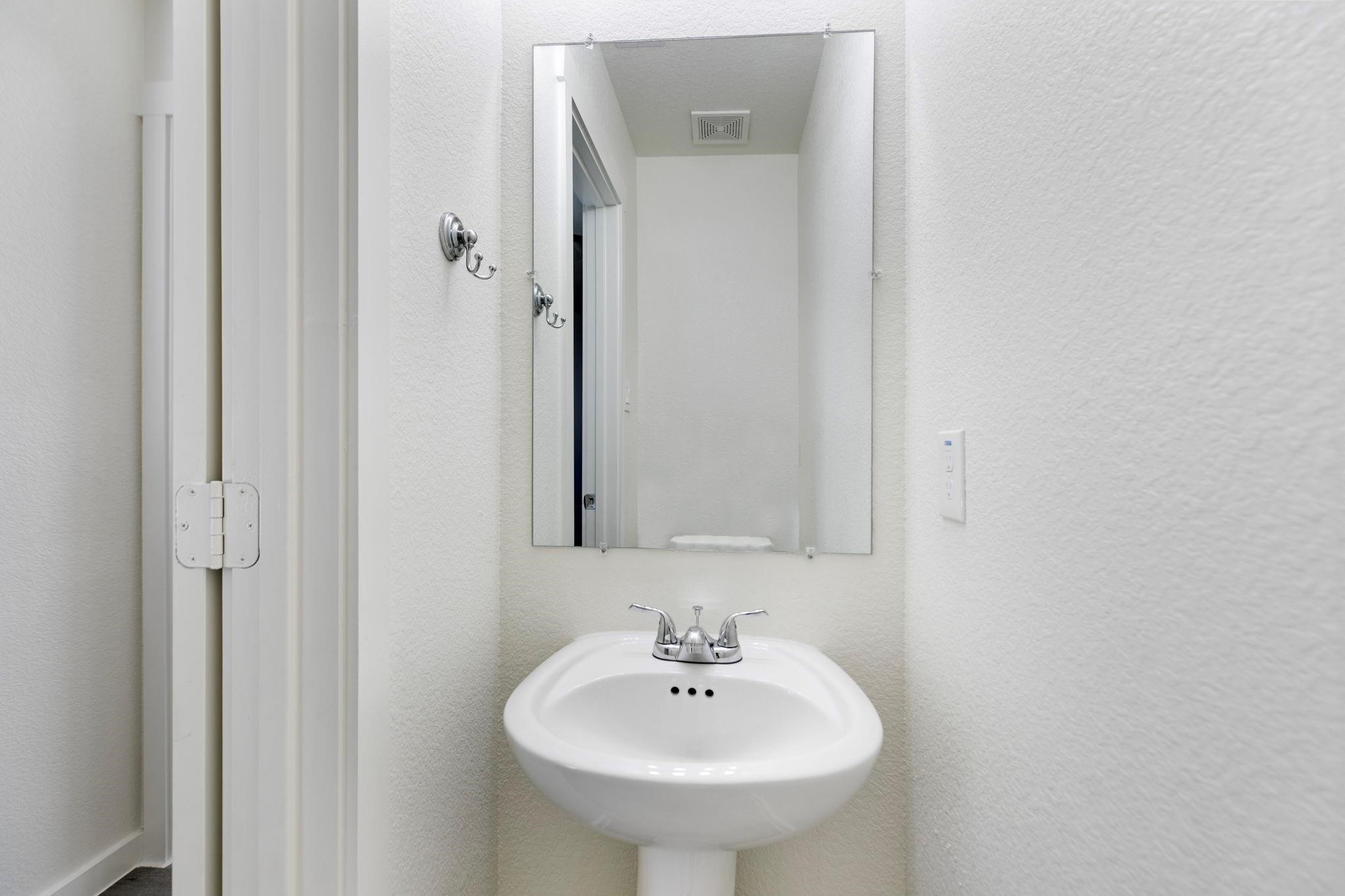 12603 Telge Road, Unit 27D Cypress, TX 77429 - Photo 11 of 27 a bathroom with a sink and a mirror