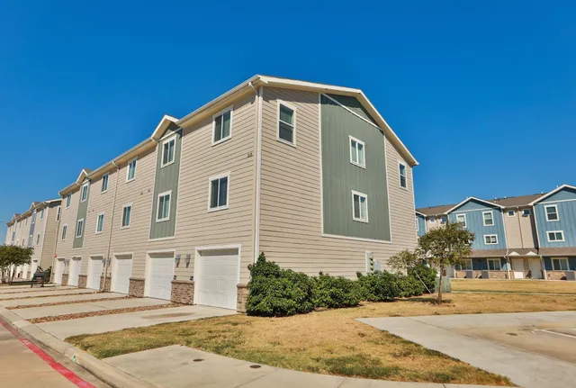 an aerial view of a building with lots of residential buildings