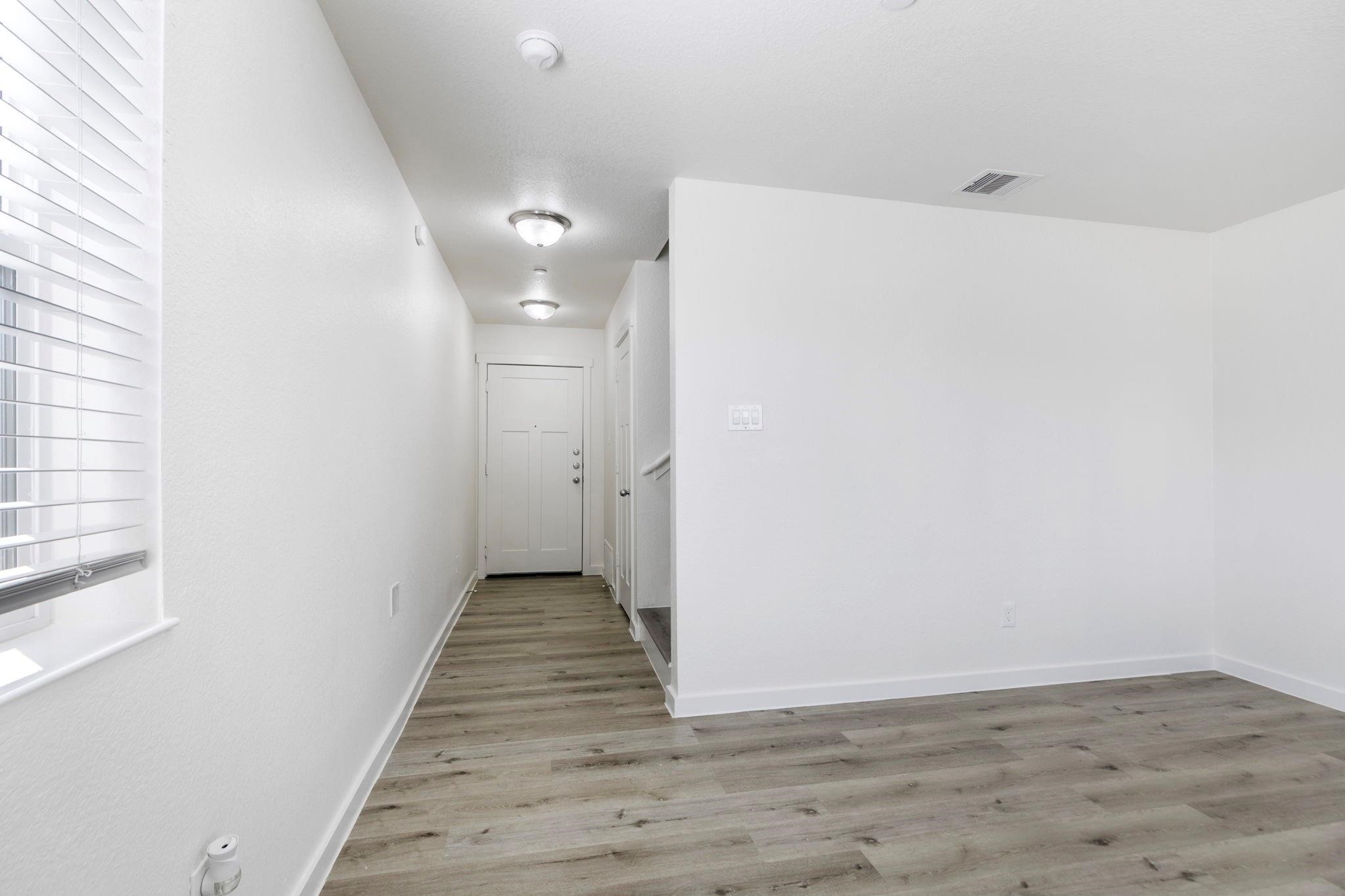 12603 Telge Road, Unit 27D Cypress, TX 77429 - Photo 6 of 27 a view of a hallway with wooden floor