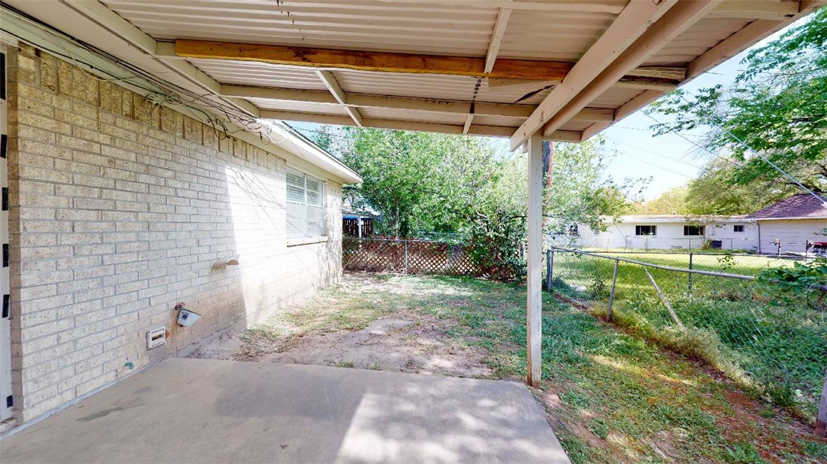 3923 Olive Street, Unit A Bryan, TX 77801 - Photo 24 of 27 a view of a backyard with plants and a patio