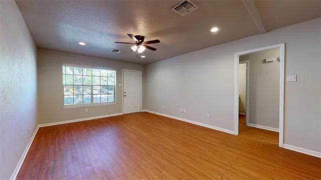 a kitchen with granite countertop a sink stove and refrigerator