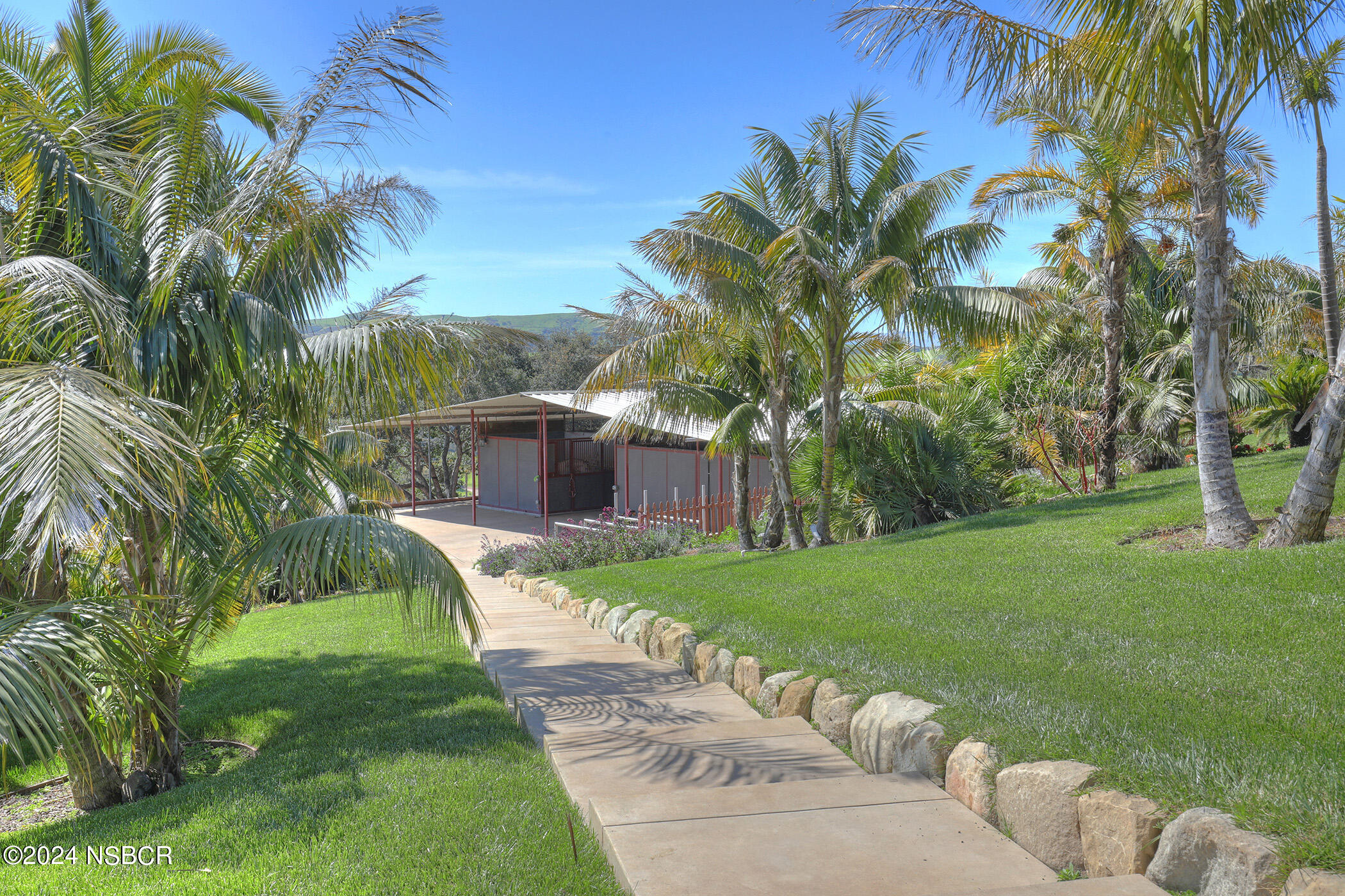 2191 Tularosa Road Lompoc, CA 93436 - Photo 19 of 67 a view of a backyard with a garden