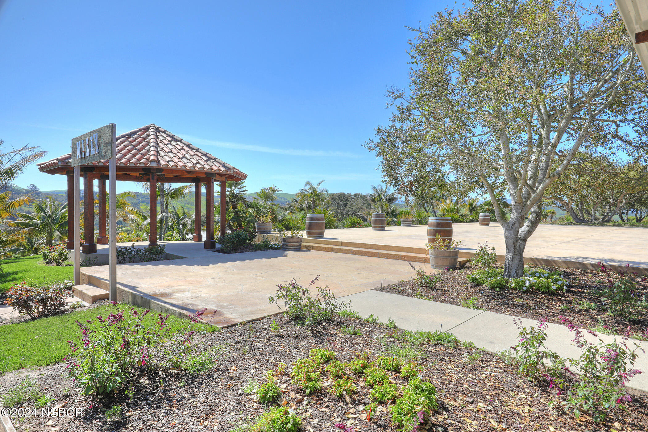 2191 Tularosa Road Lompoc, CA 93436 - Photo 30 of 67 a view of a street with a bench and trees