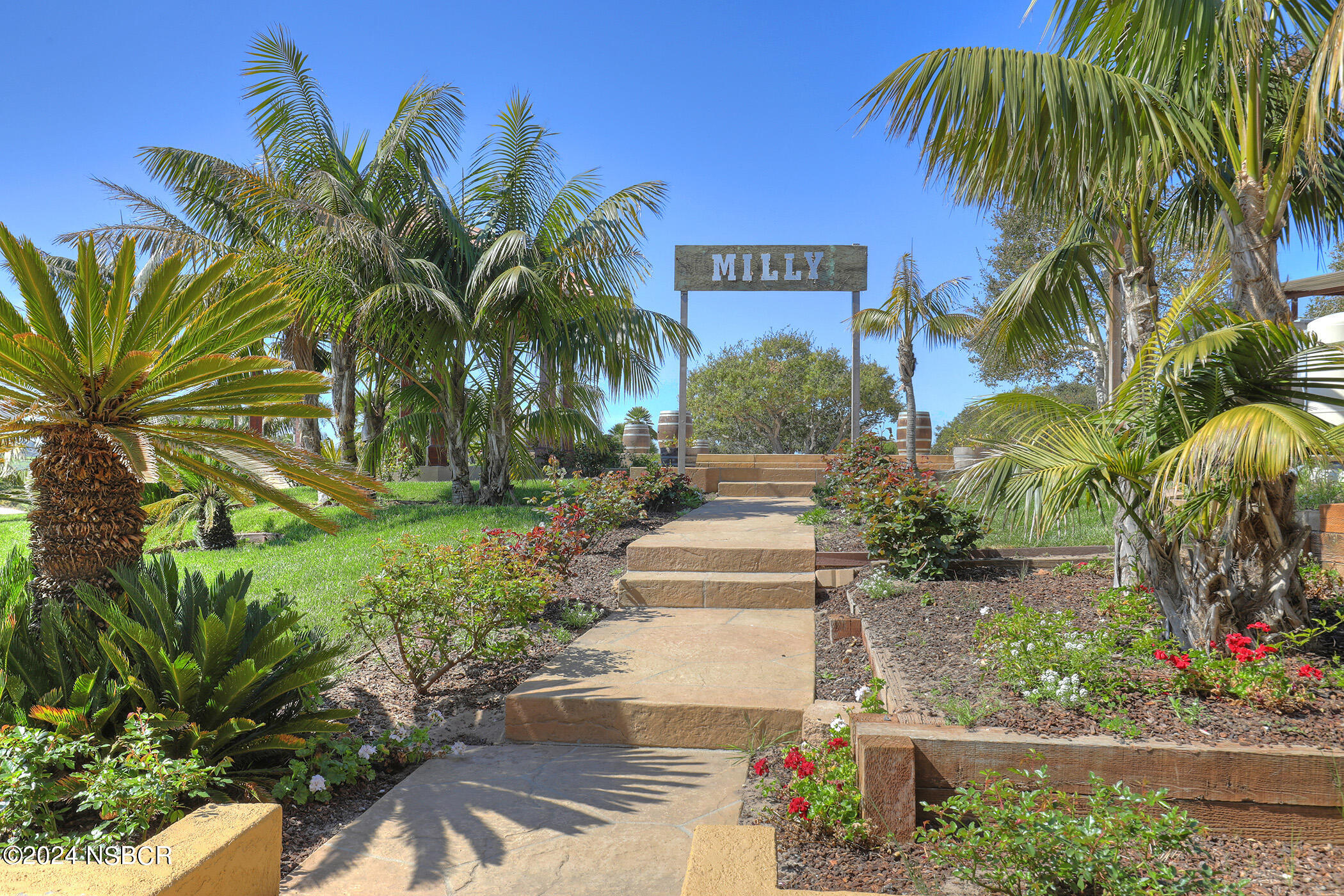 2191 Tularosa Road Lompoc, CA 93436 - Photo 33 of 67 a front view of multi story residential apartment building with yard and sign board