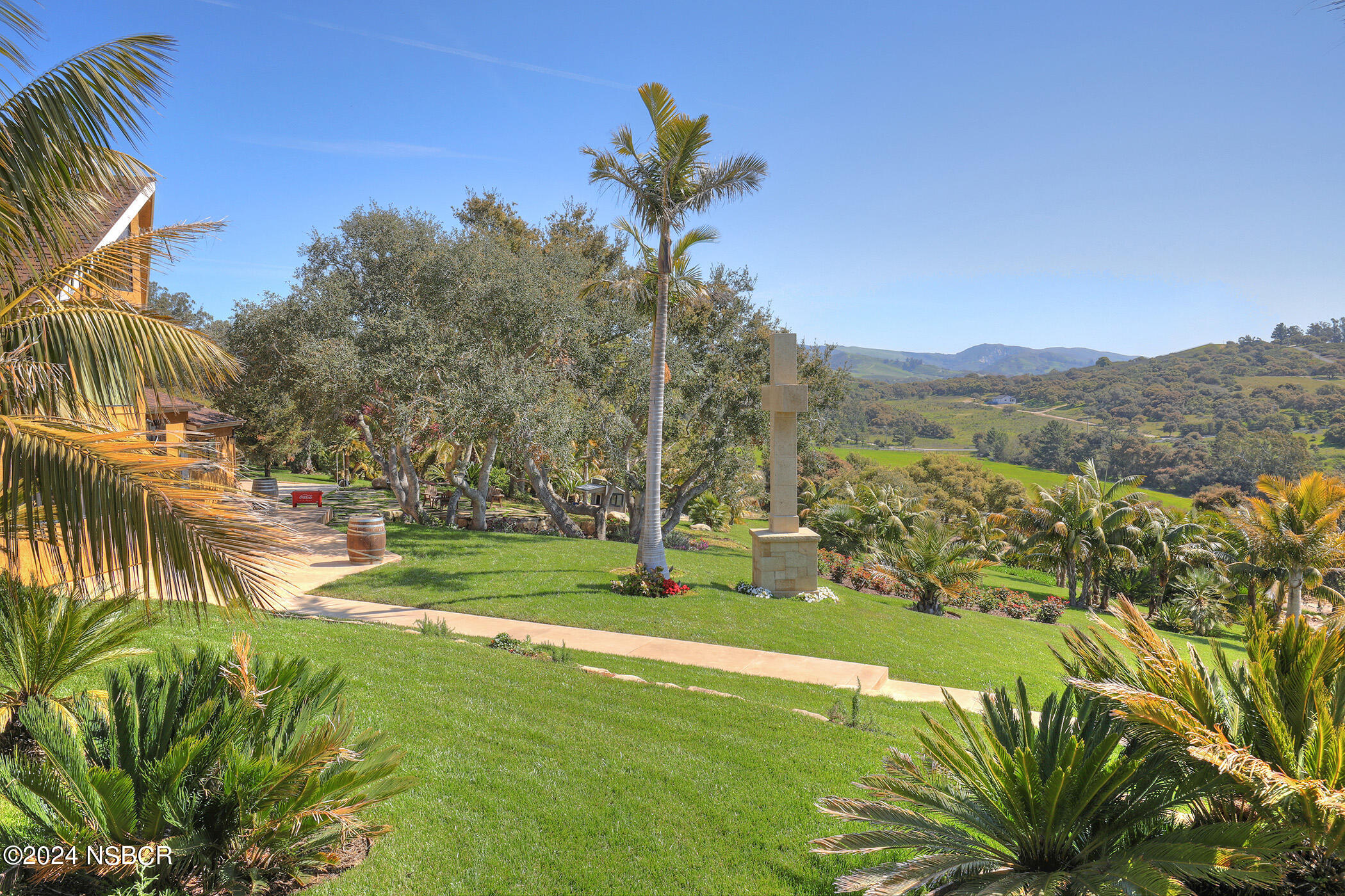 2191 Tularosa Road Lompoc, CA 93436 - Photo 37 of 67 a view of a garden with a building in the background