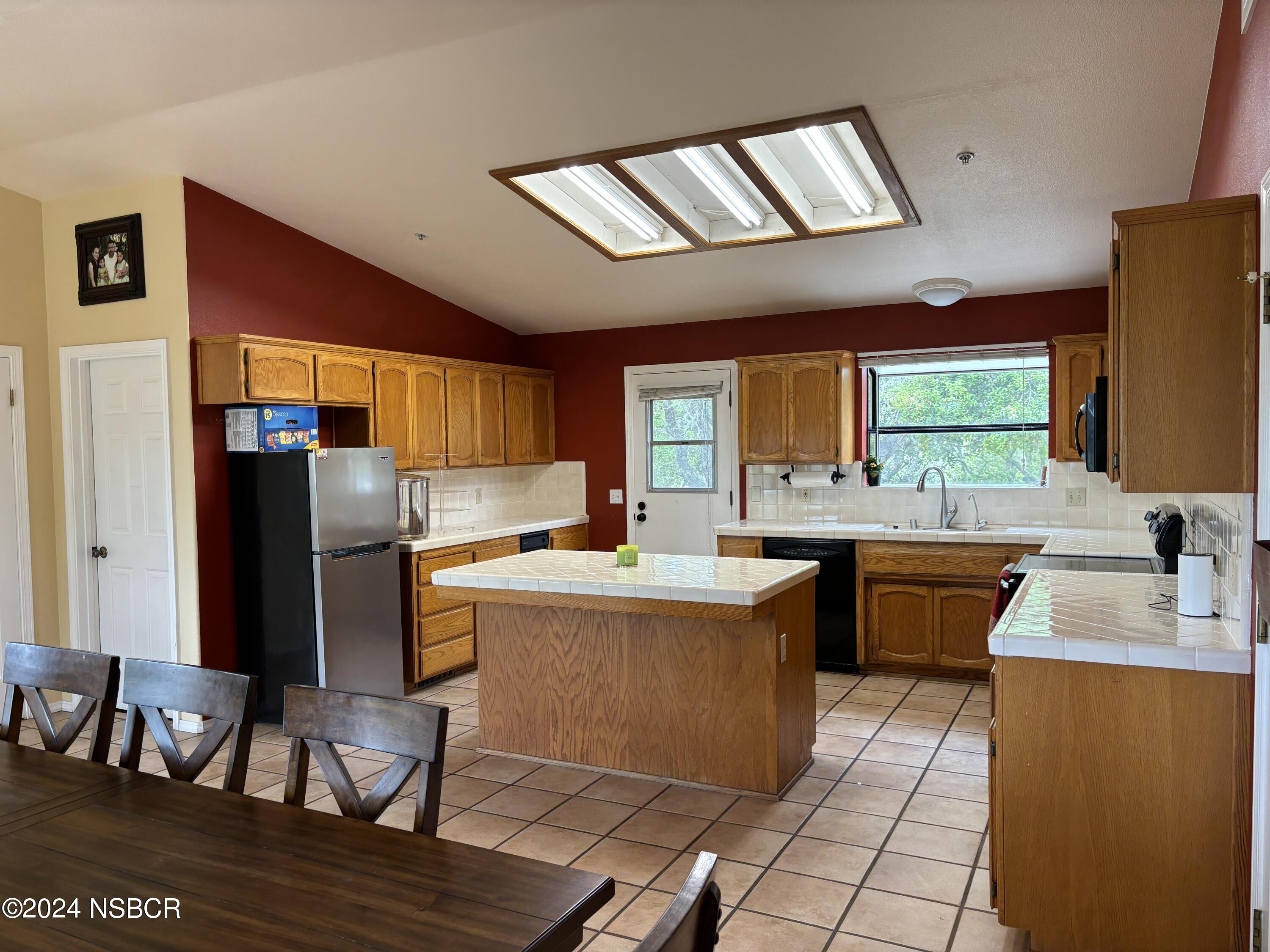 2191 Tularosa Road Lompoc, CA 93436 - Photo 55 of 67 a kitchen with stainless steel appliances granite countertop a sink stove and refrigerator