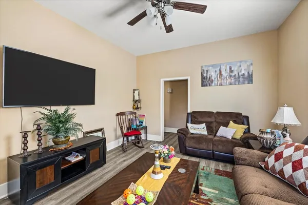 a living room with furniture and a flat screen tv