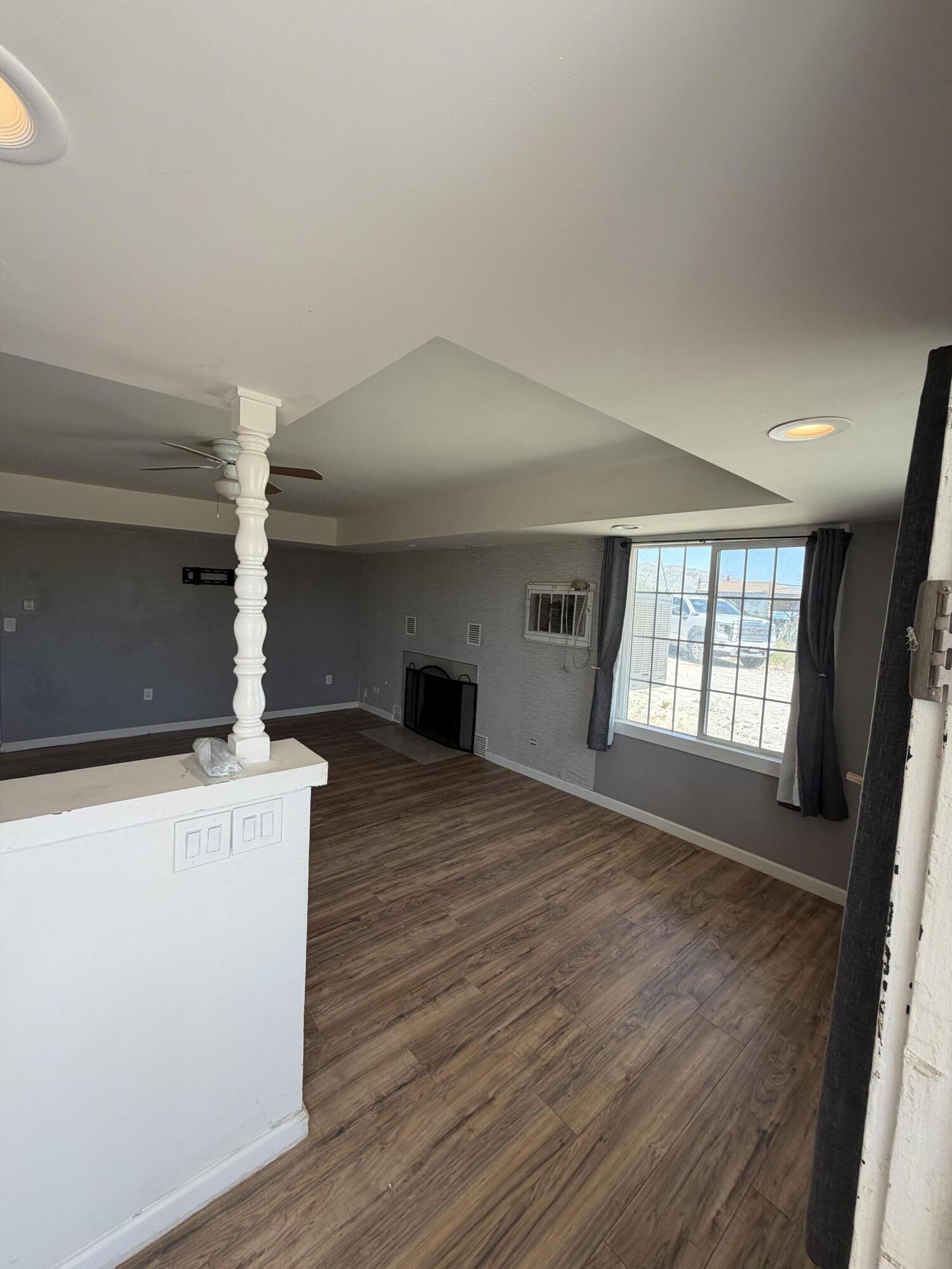 50988 Canyon Road Morongo Valley, CA 92256 - Photo 12 of 68 wooden floor in an empty room with a window