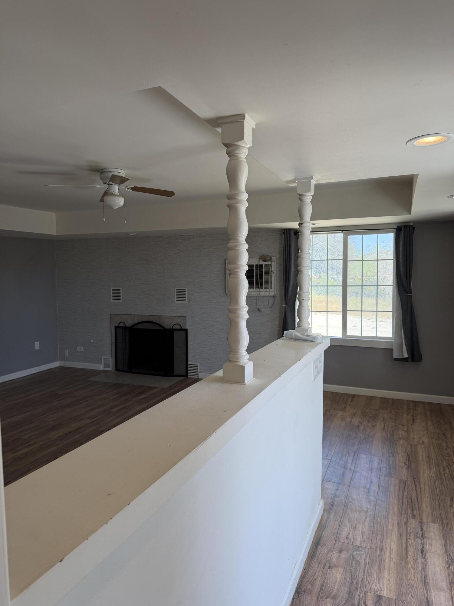 50988 Canyon Road Morongo Valley, CA 92256 - Photo 13 of 68 a view of an empty room with a fireplace and a window