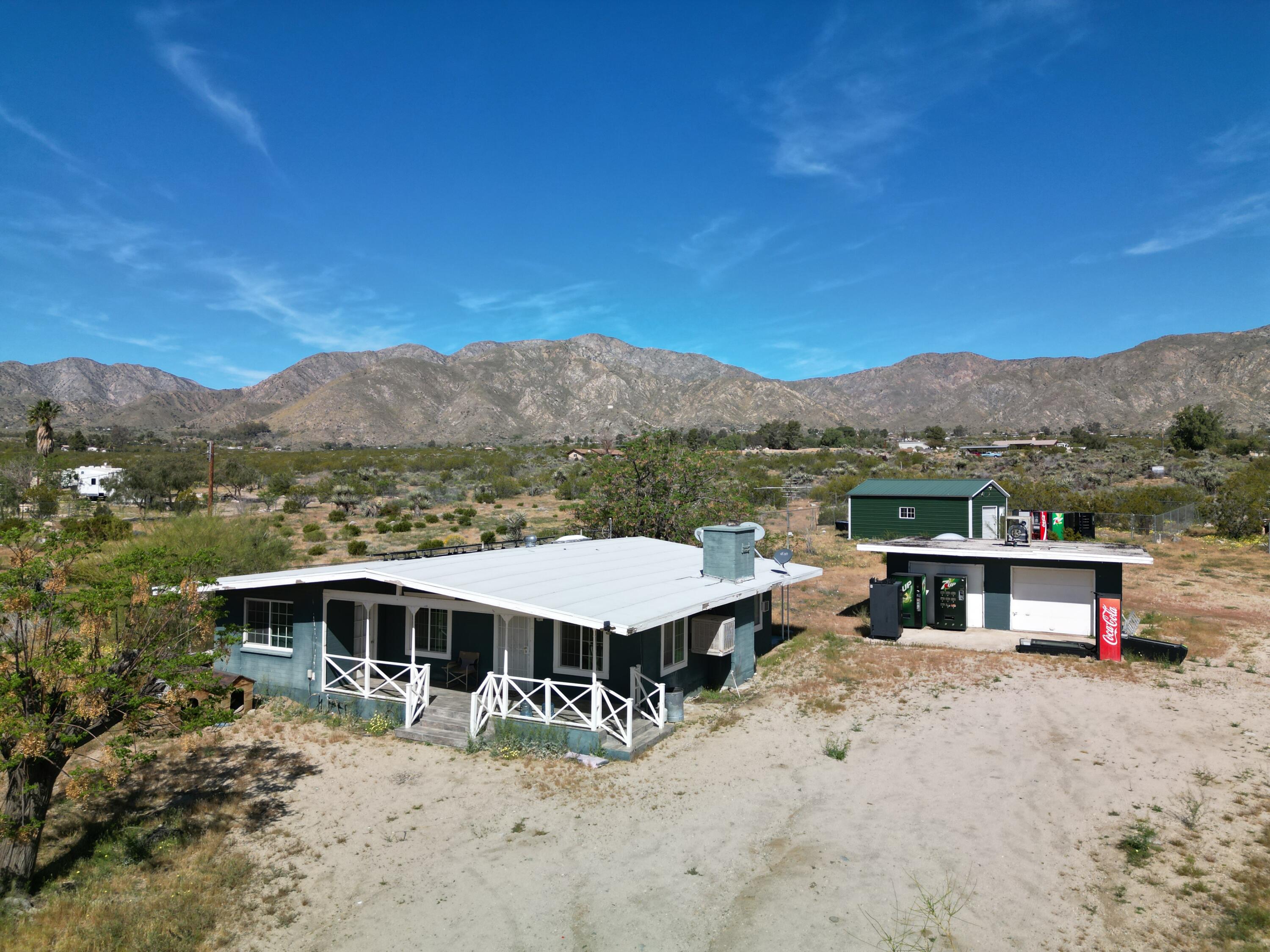 50988 Canyon Road Morongo Valley, CA 92256 - Photo 2 of 68 a view of a town with large trees