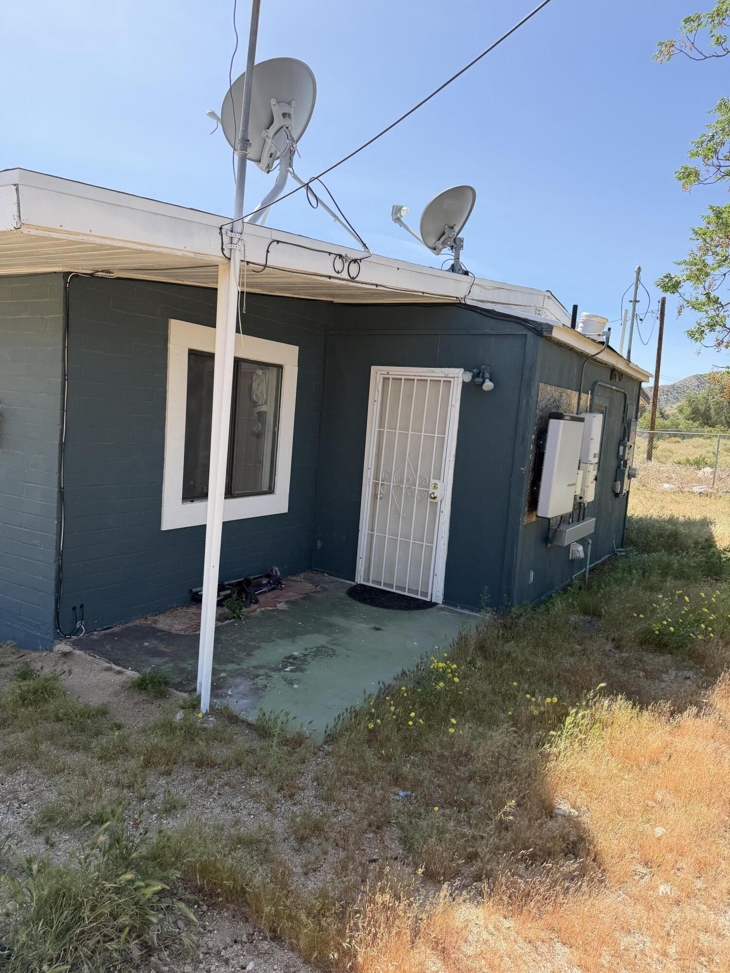 50988 Canyon Road Morongo Valley, CA 92256 - Photo 24 of 68 a view of a house with a door and wooden floor