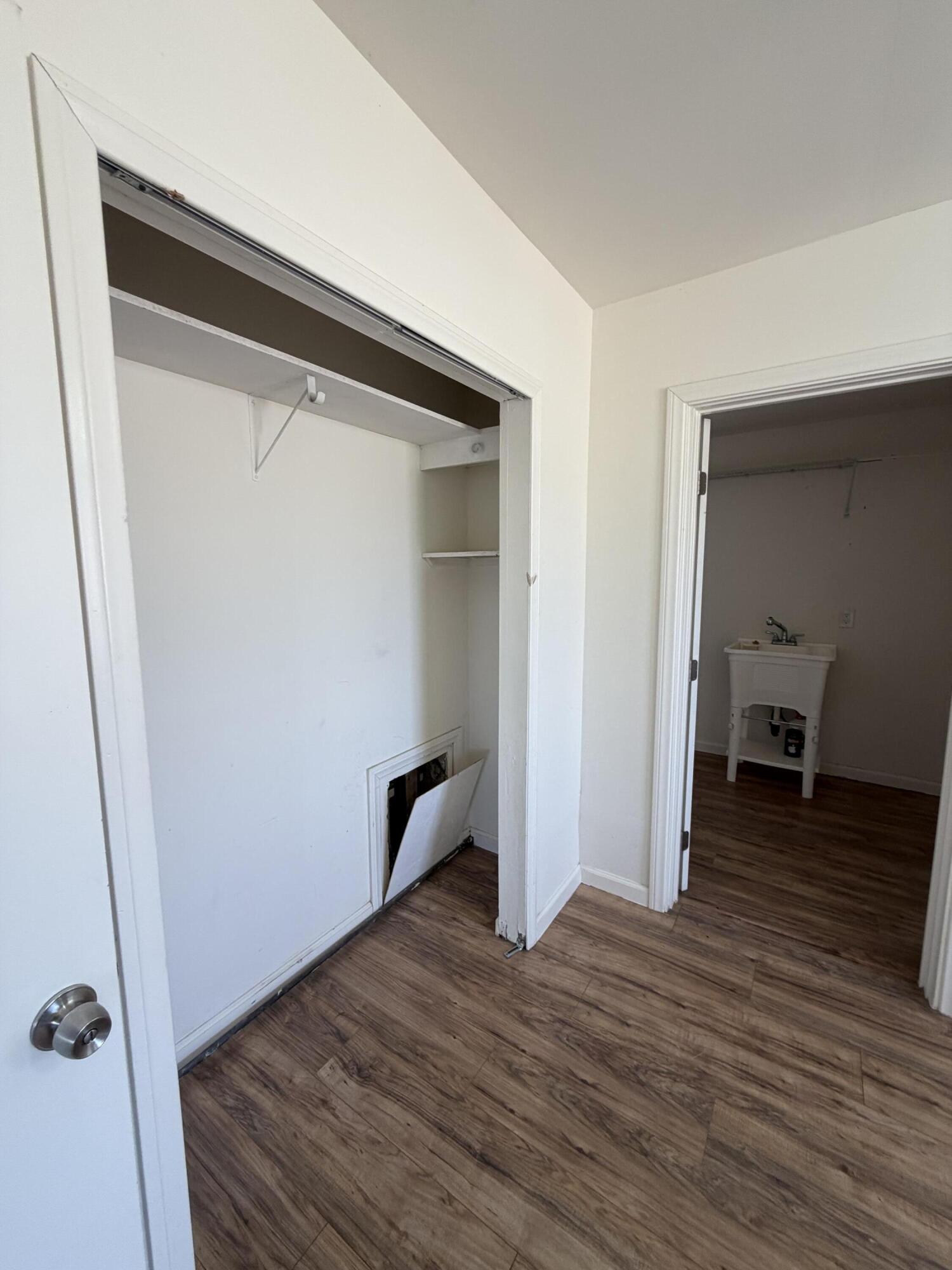 50988 Canyon Road Morongo Valley, CA 92256 - Photo 25 of 68 an empty room with wooden floor and closet