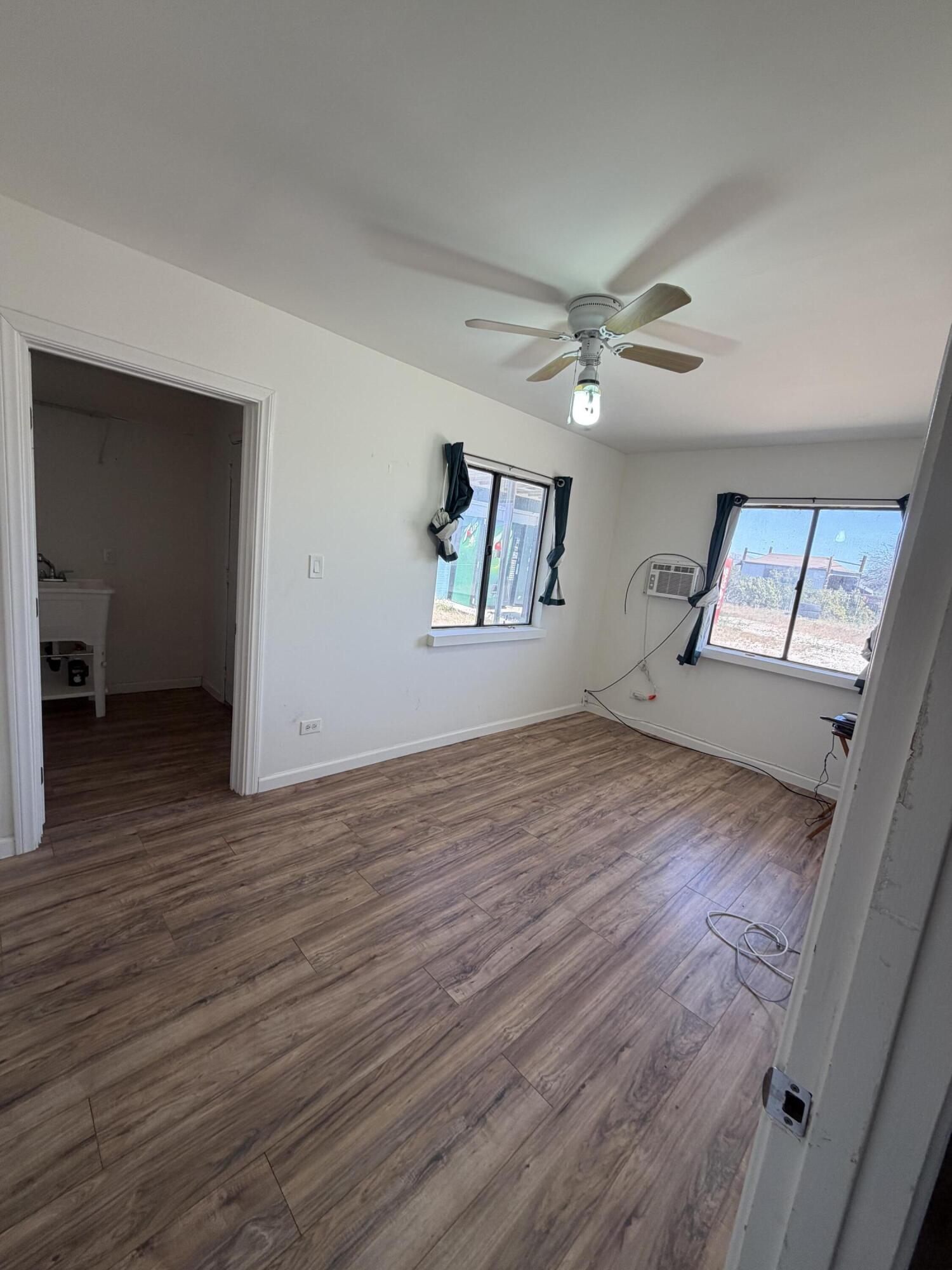 50988 Canyon Road Morongo Valley, CA 92256 - Photo 26 of 68 wooden floor in an empty room with a window