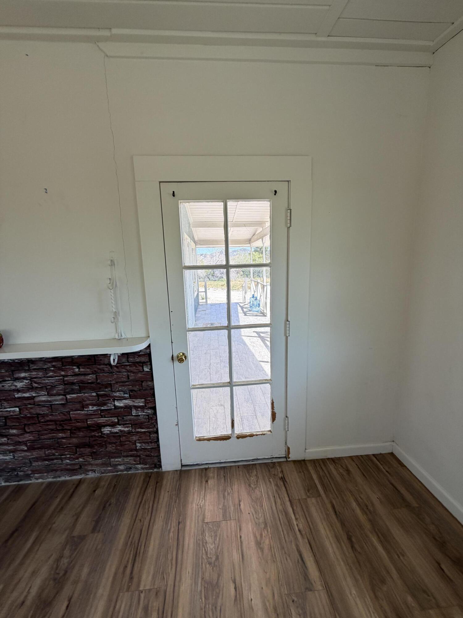 50988 Canyon Road Morongo Valley, CA 92256 - Photo 33 of 68 a view of a room with wooden floor and white walls