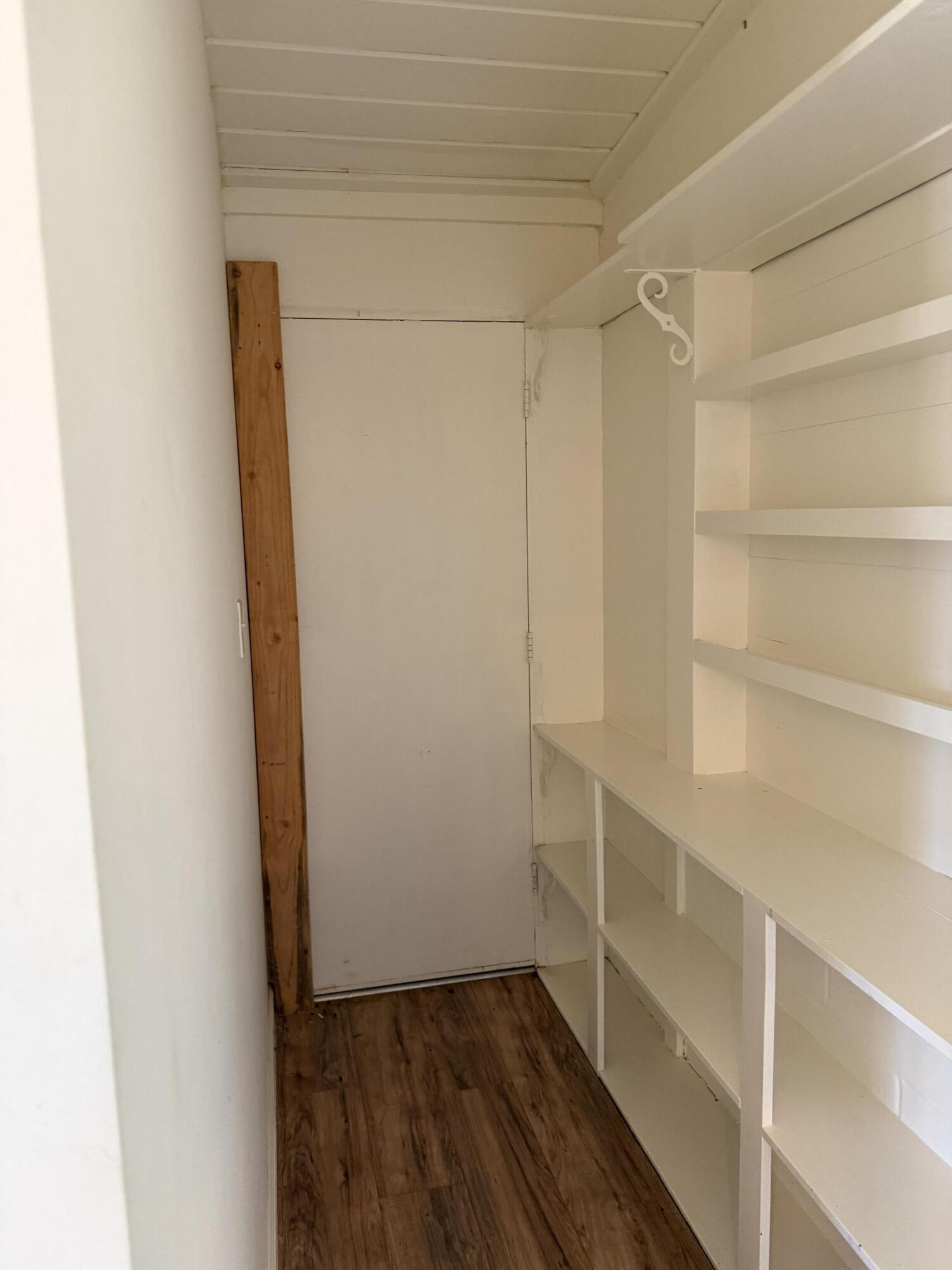 50988 Canyon Road Morongo Valley, CA 92256 - Photo 36 of 68 a view of walk in closet with empty racks
