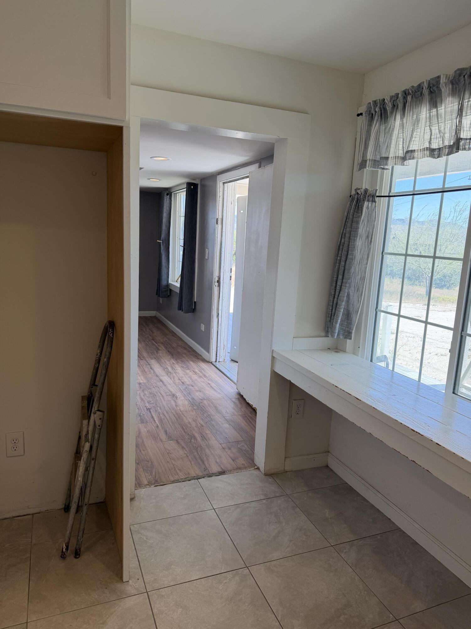 50988 Canyon Road Morongo Valley, CA 92256 - Photo 41 of 68 a view of hallway with stairs and wooden floor