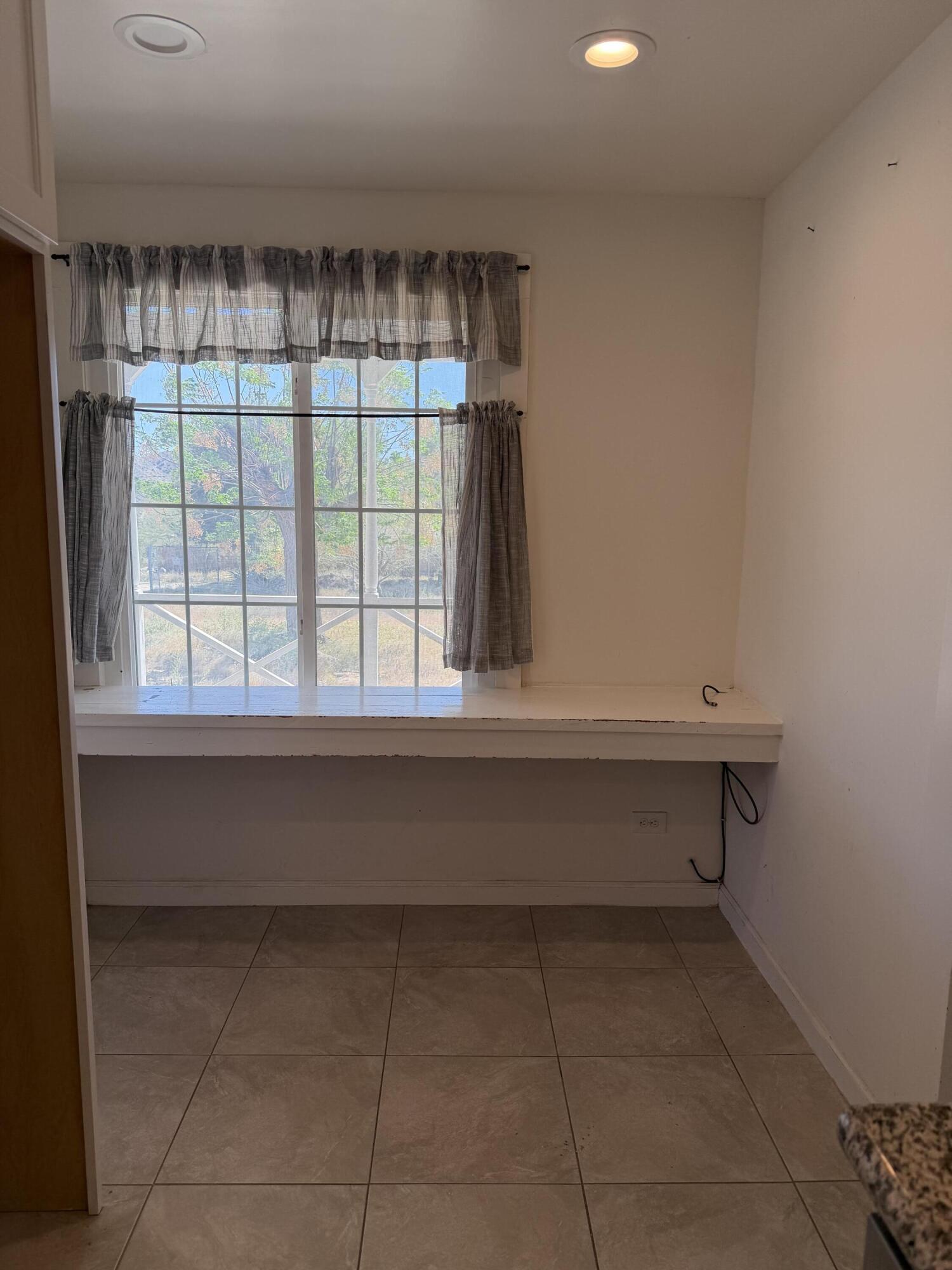 50988 Canyon Road Morongo Valley, CA 92256 - Photo 43 of 68 a view of room with window and a ceiling fan