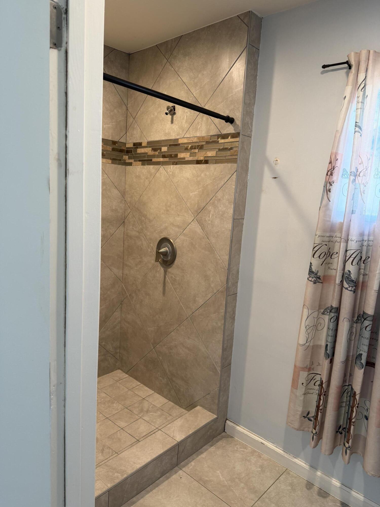 50988 Canyon Road Morongo Valley, CA 92256 - Photo 46 of 68 a bathroom with a glass door shower
