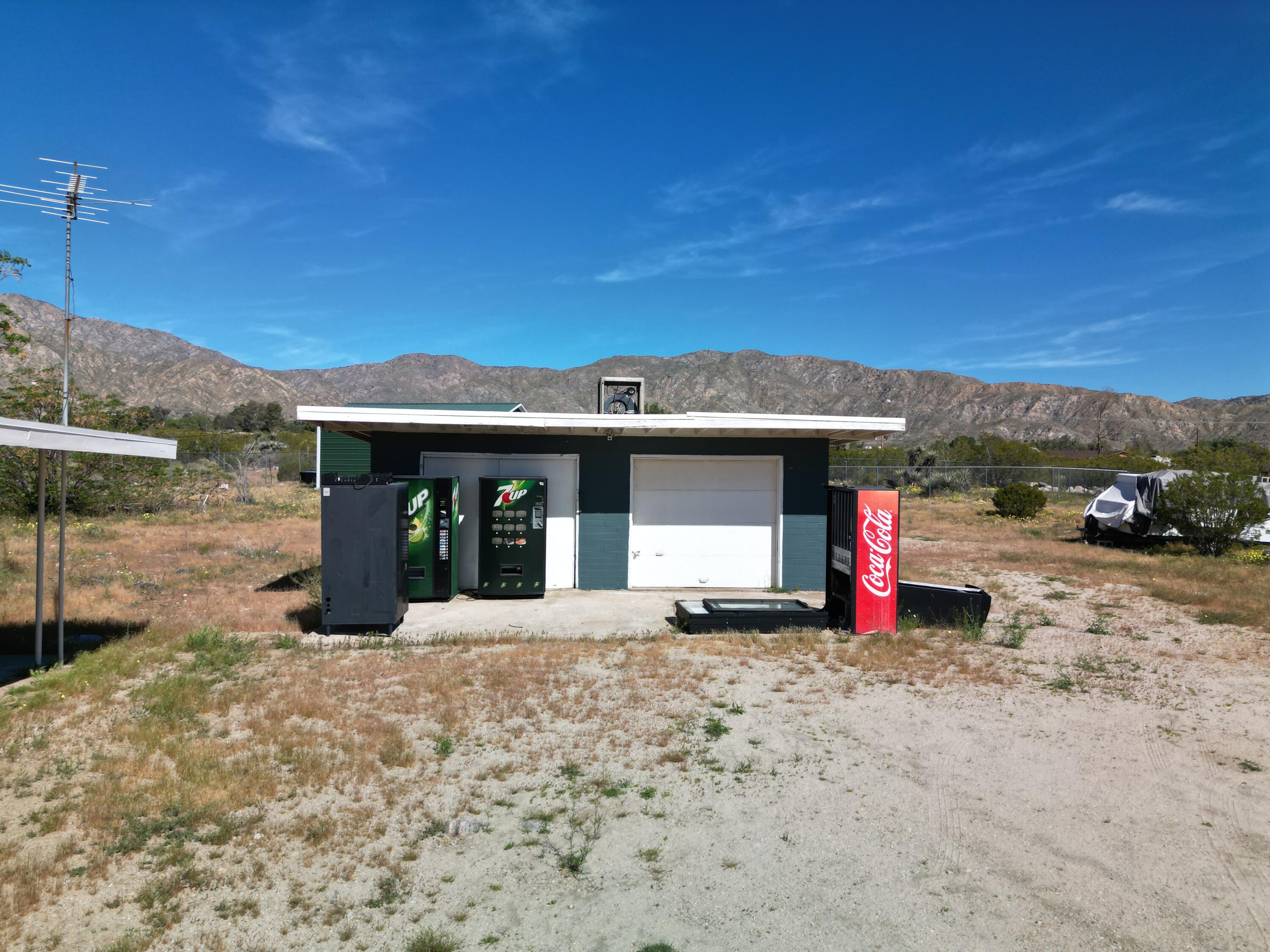 50988 Canyon Road Morongo Valley, CA 92256 - Photo 53 of 68 a front view of a house with a yard and garage