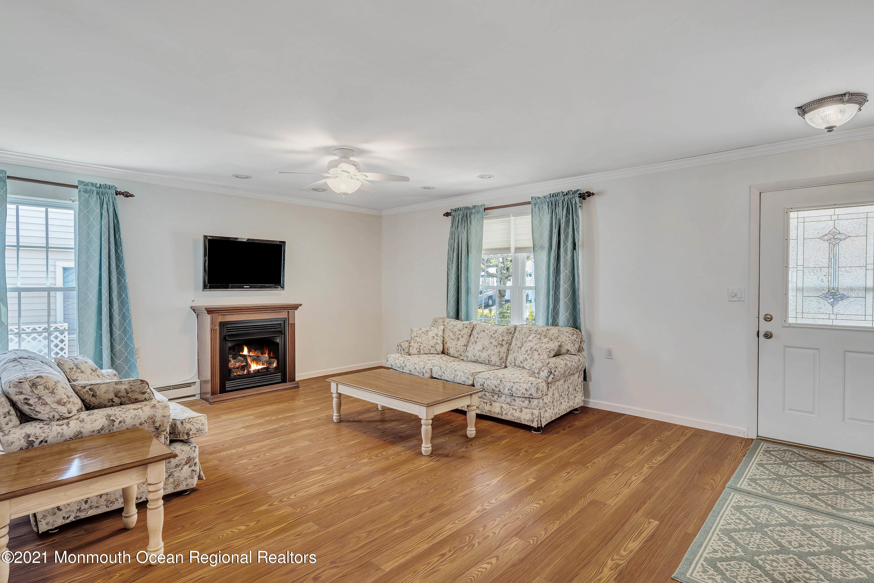 14 Maidstone Way Manchester Township, NJ 08759 - Photo 13 of 49 a living room with furniture a fireplace and a flat screen tv