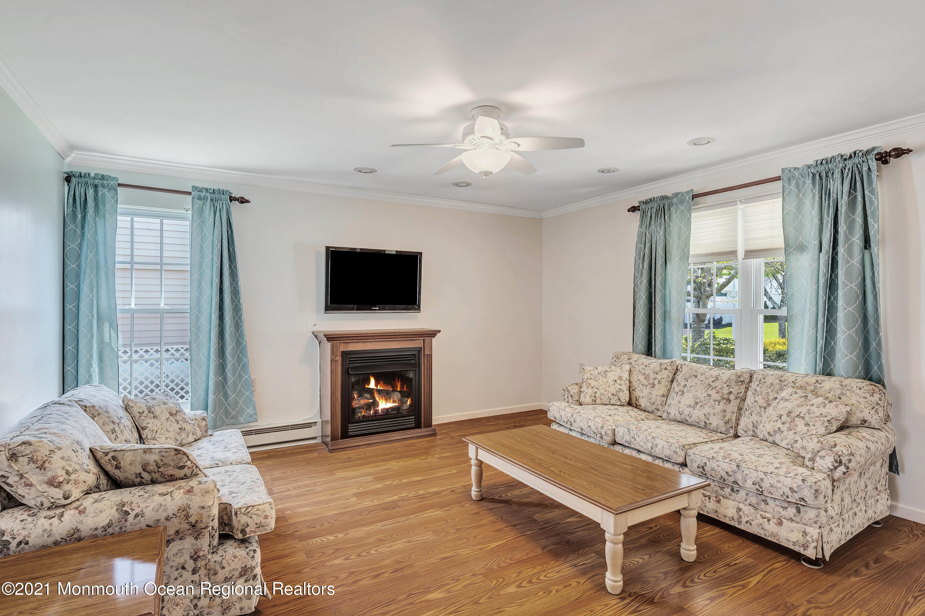 14 Maidstone Way Manchester Township, NJ 08759 - Photo 14 of 49 a living room with furniture flat screen tv and a fireplace