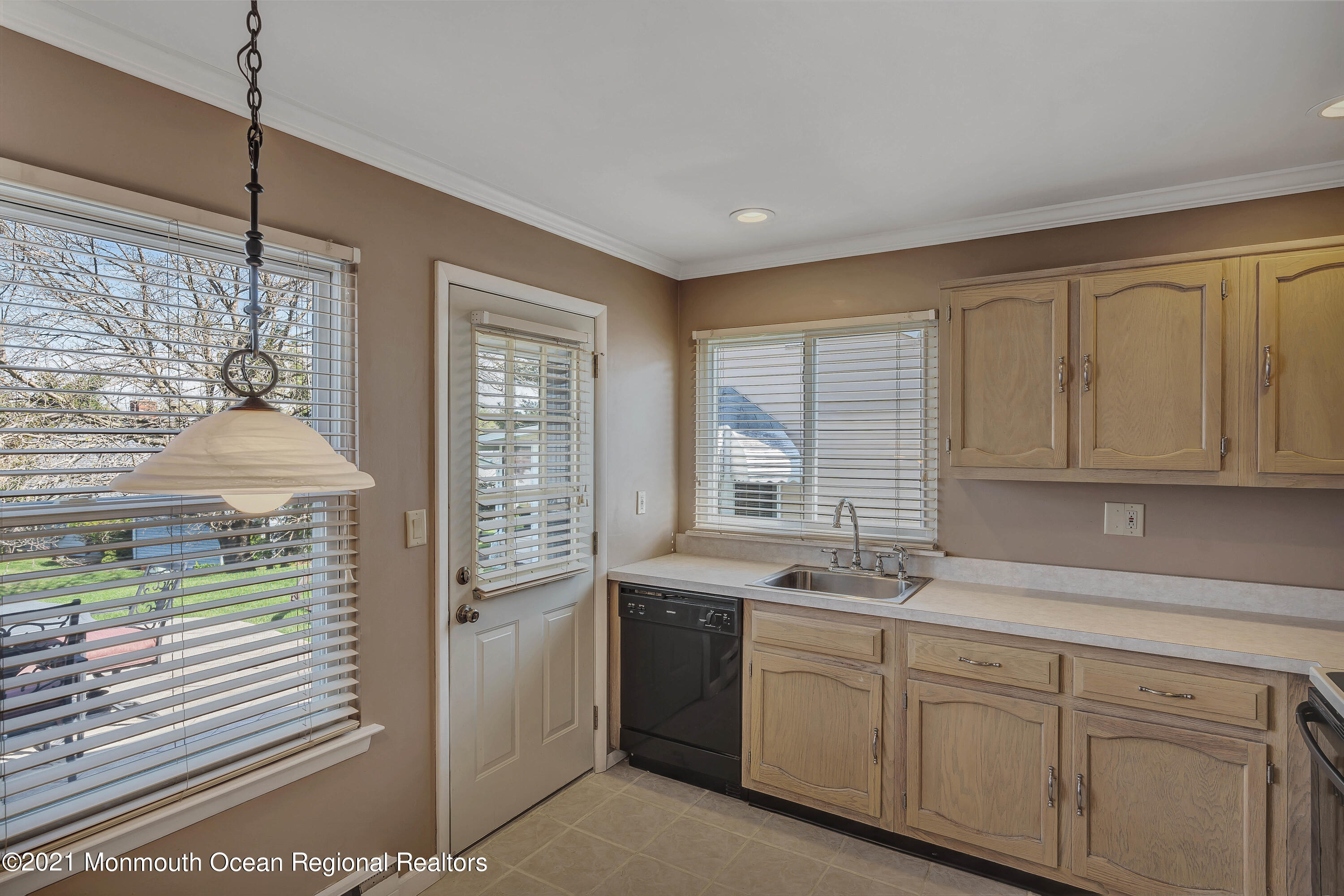 14 Maidstone Way Manchester Township, NJ 08759 - Photo 17 of 49 a kitchen with a sink window and cabinets