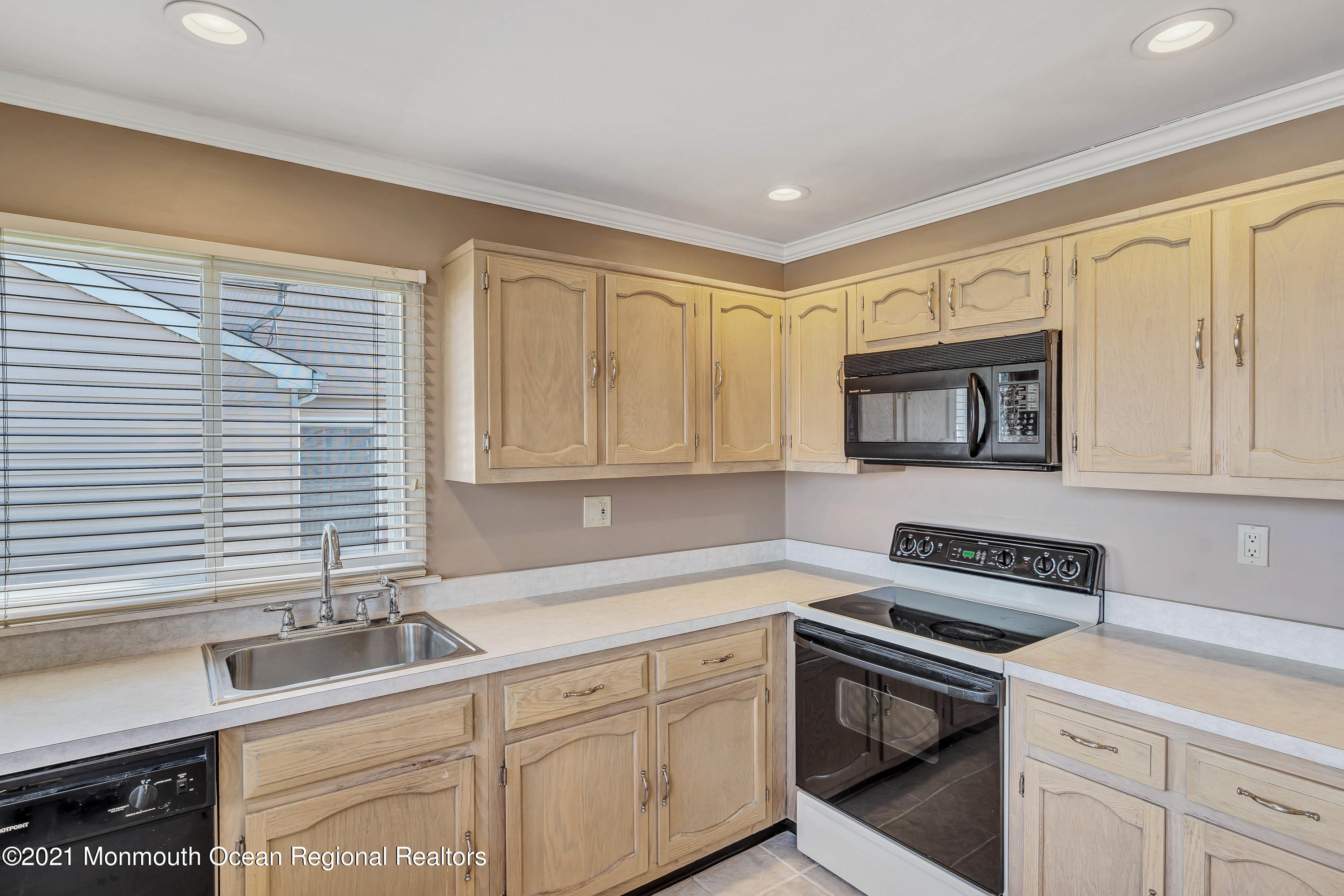14 Maidstone Way Manchester Township, NJ 08759 - Photo 20 of 49 a kitchen with stainless steel appliances white cabinets and a sink