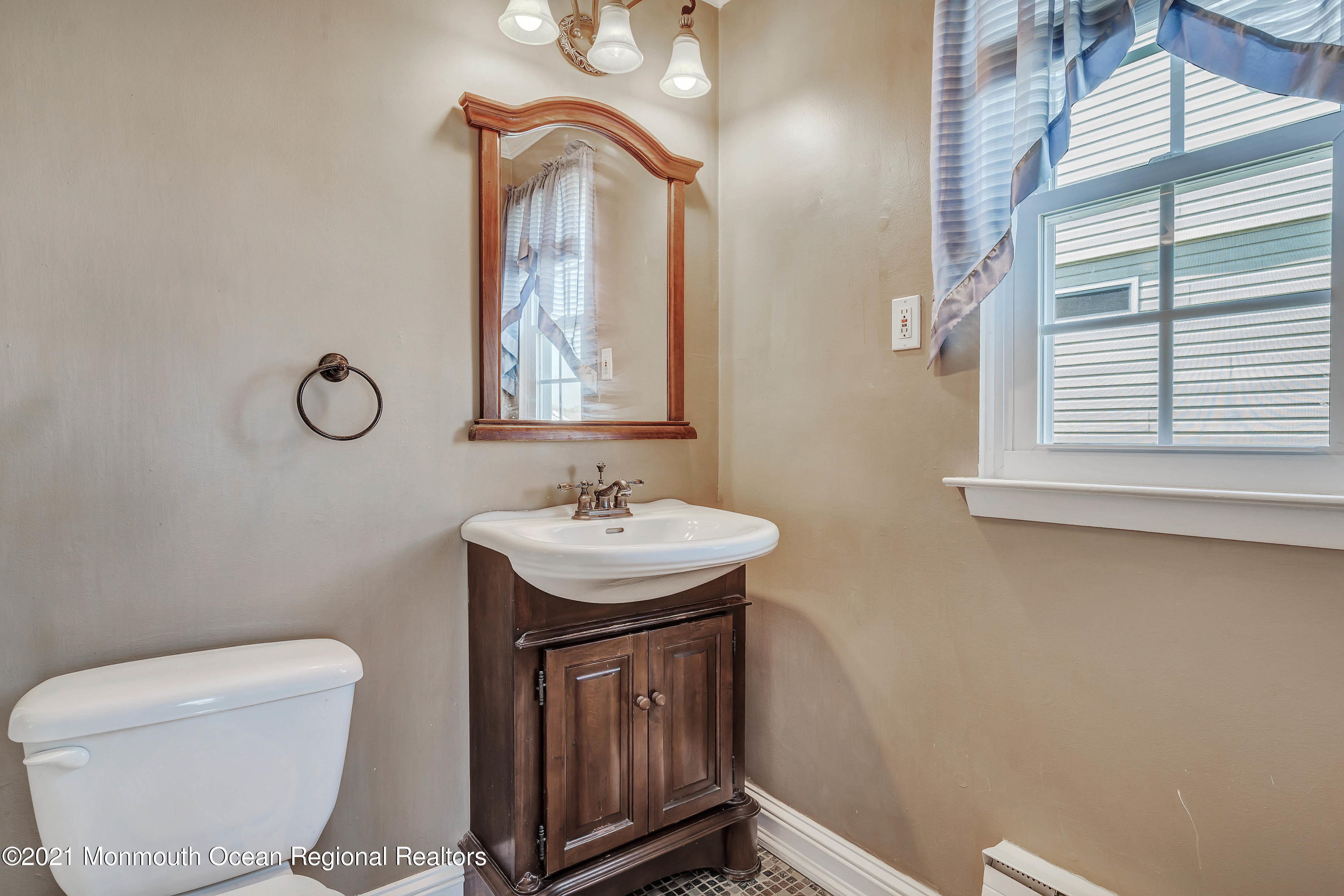14 Maidstone Way Manchester Township, NJ 08759 - Photo 36 of 49 a bathroom with a toilet sink and mirror
