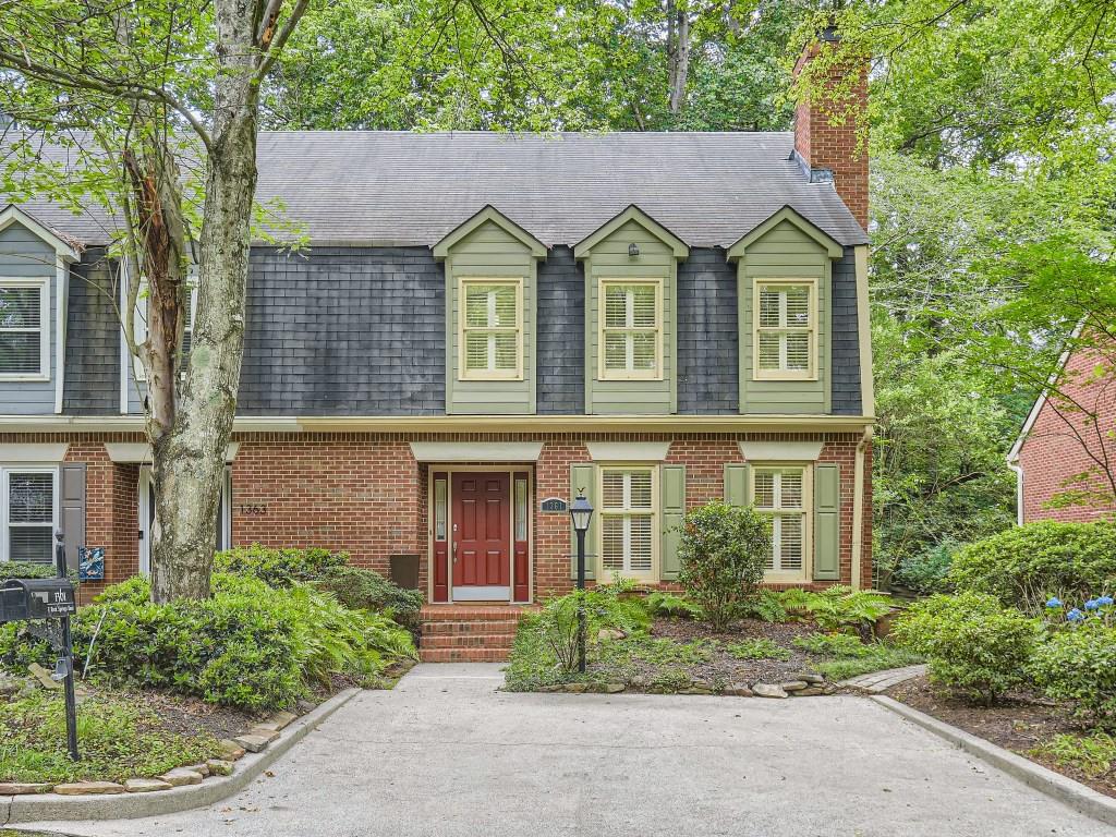 1361 East Rock Springs Road Northeast Atlanta, GA 30306 - Photo 1 of 1 front view of a house with a garden
