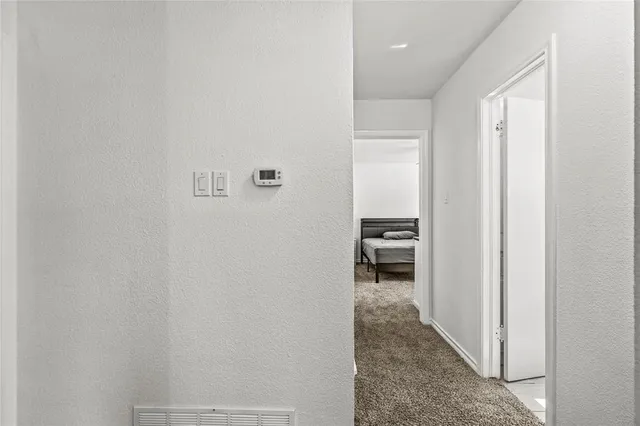 a view of a bedroom from a hallway