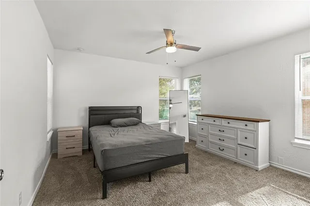 a bedroom with a bed and a cabinets