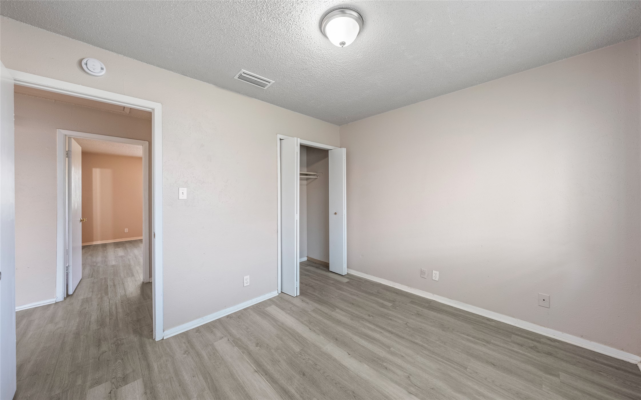 1111 West Rundberg Lane Austin, TX 78758 - Photo 8 of 16 Newly installed wood-look flooring adds a fresh touch to this welcoming room.