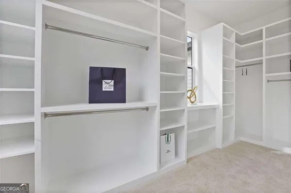 a view of an empty walk in closet