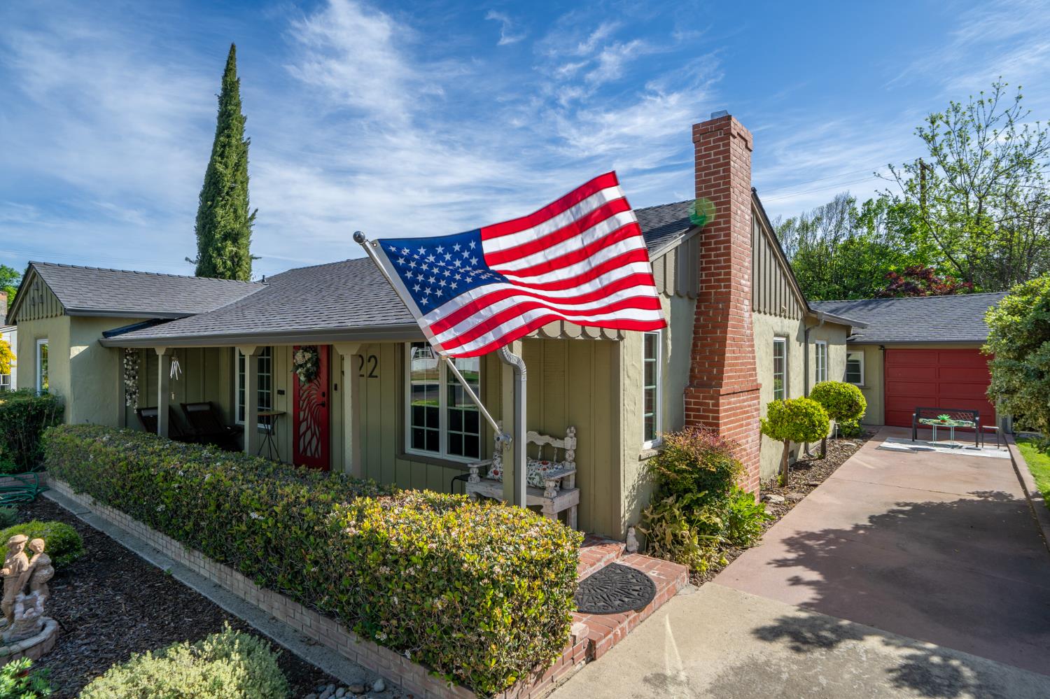 322 North Santa Ana Avenue Modesto, CA 95354 - Photo 1 of 1 a front view of a house with entryway and flower plants