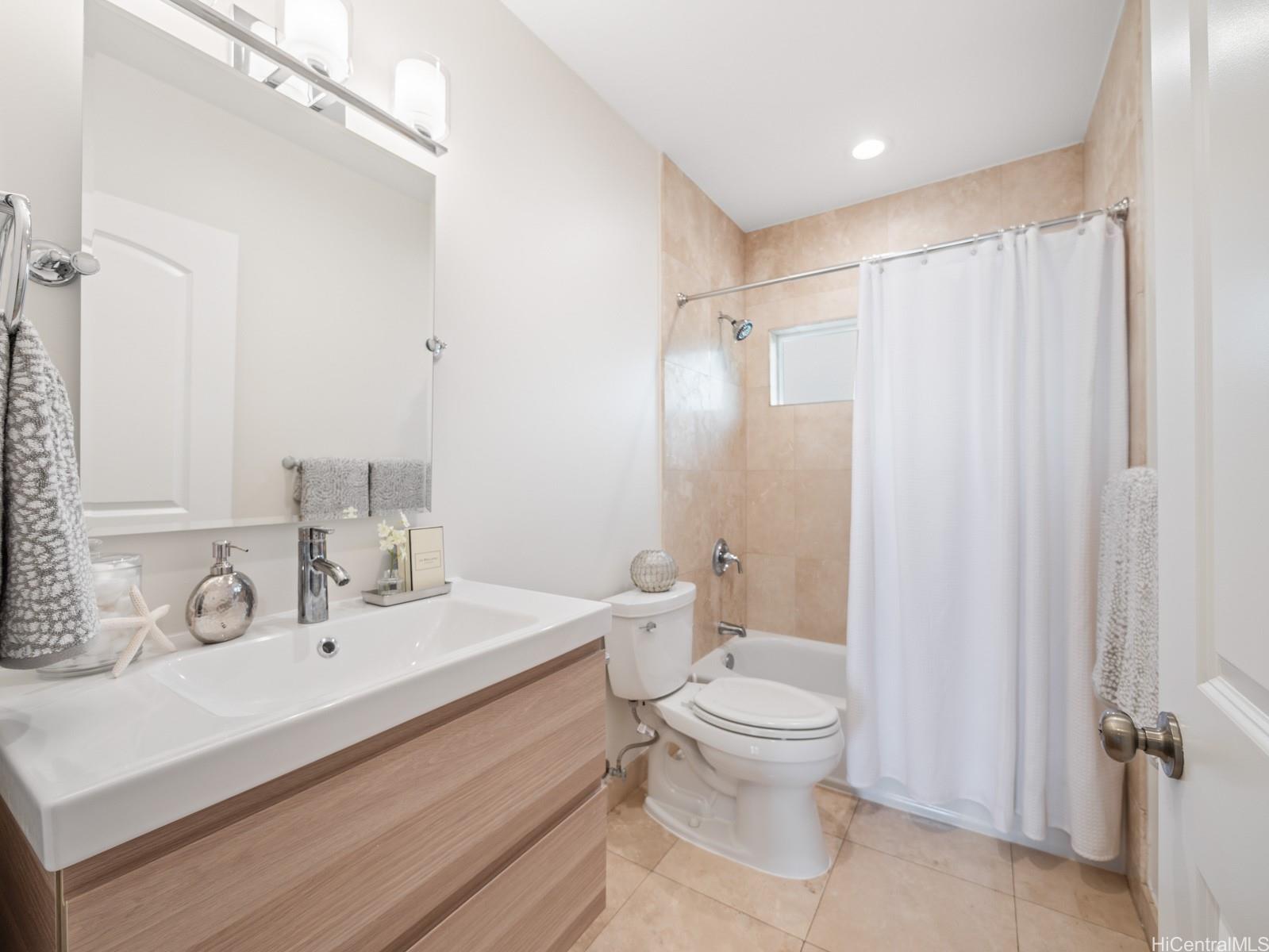 59-355 Ke Nui Road Haleiwa, HI 96712 - Photo 15 of 25 a bathroom with a sink a toilet and shower